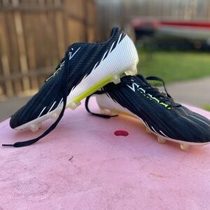 Black Soccer Cleats with Yellow Accents